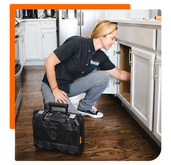 service technician checking the plumbing