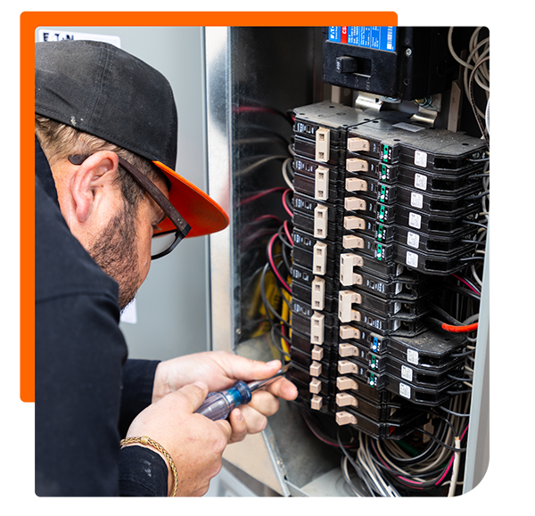 service technician checking a circut
