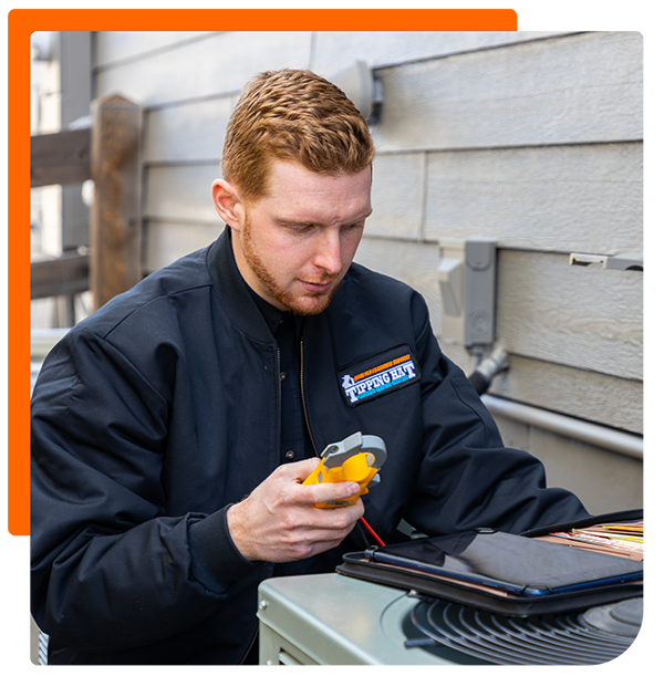 service technician checking a HVAC system